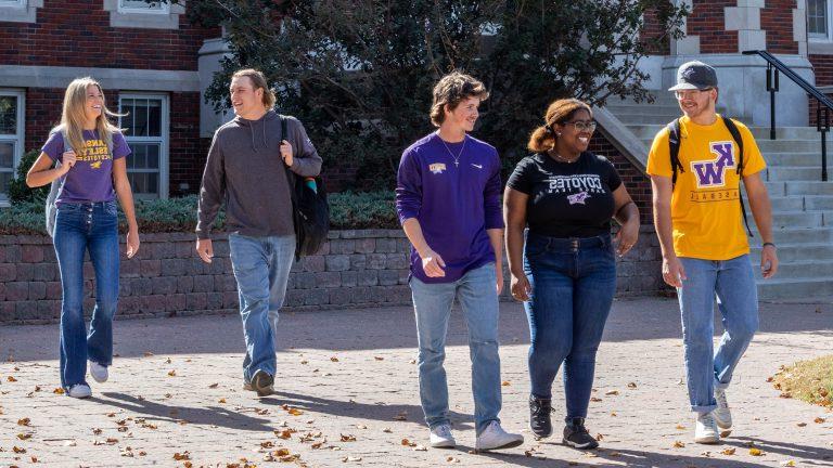 Students walking on sidewalk